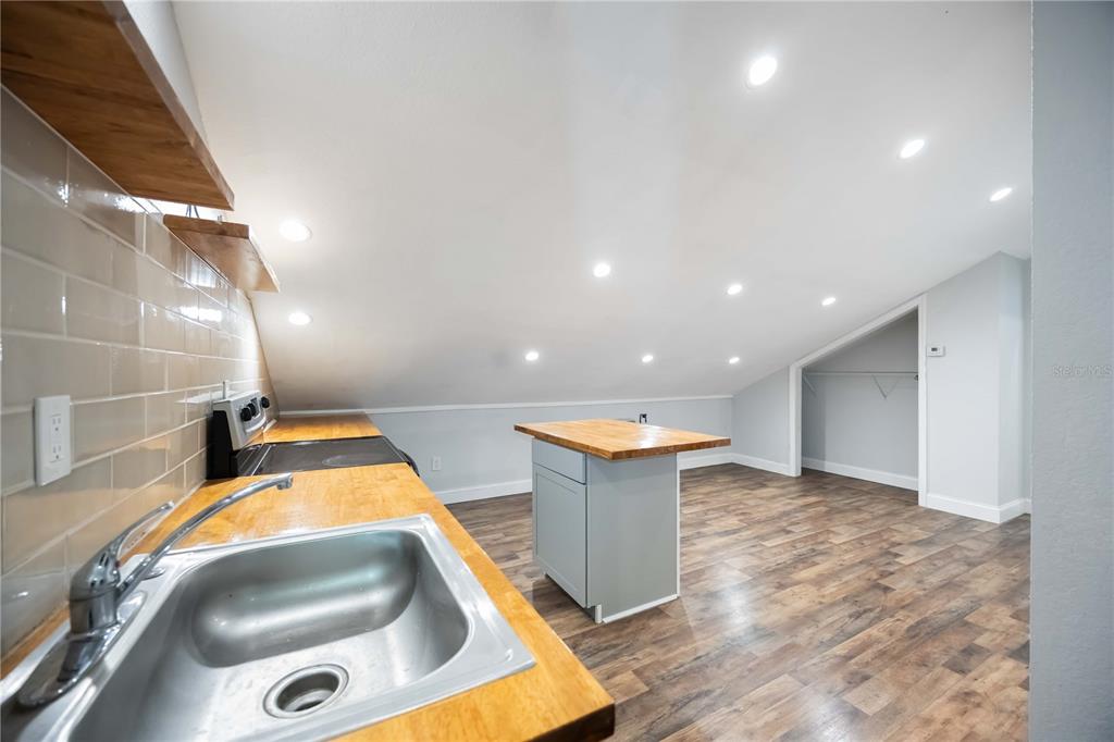 7348 Coach Road Port Charlotte, FL 33981 - Photo 22 of 48 a view of a bathroom with a sink and mirror