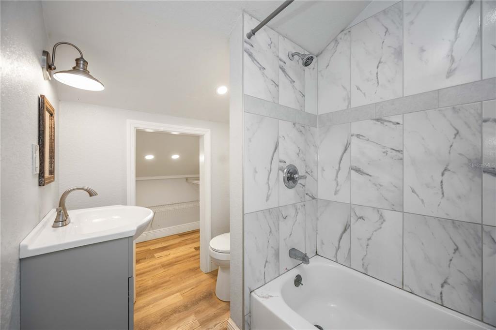 7348 Coach Road Port Charlotte, FL 33981 - Photo 25 of 48 a bathroom with a sink a toilet and shower