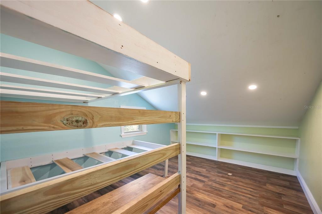 7348 Coach Road Port Charlotte, FL 33981 - Photo 26 of 48 a view of room with wooden floor