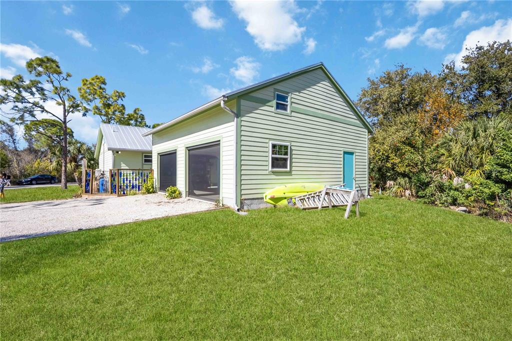 7348 Coach Road Port Charlotte, FL 33981 - Photo 36 of 48 a front view of house with yard and green space