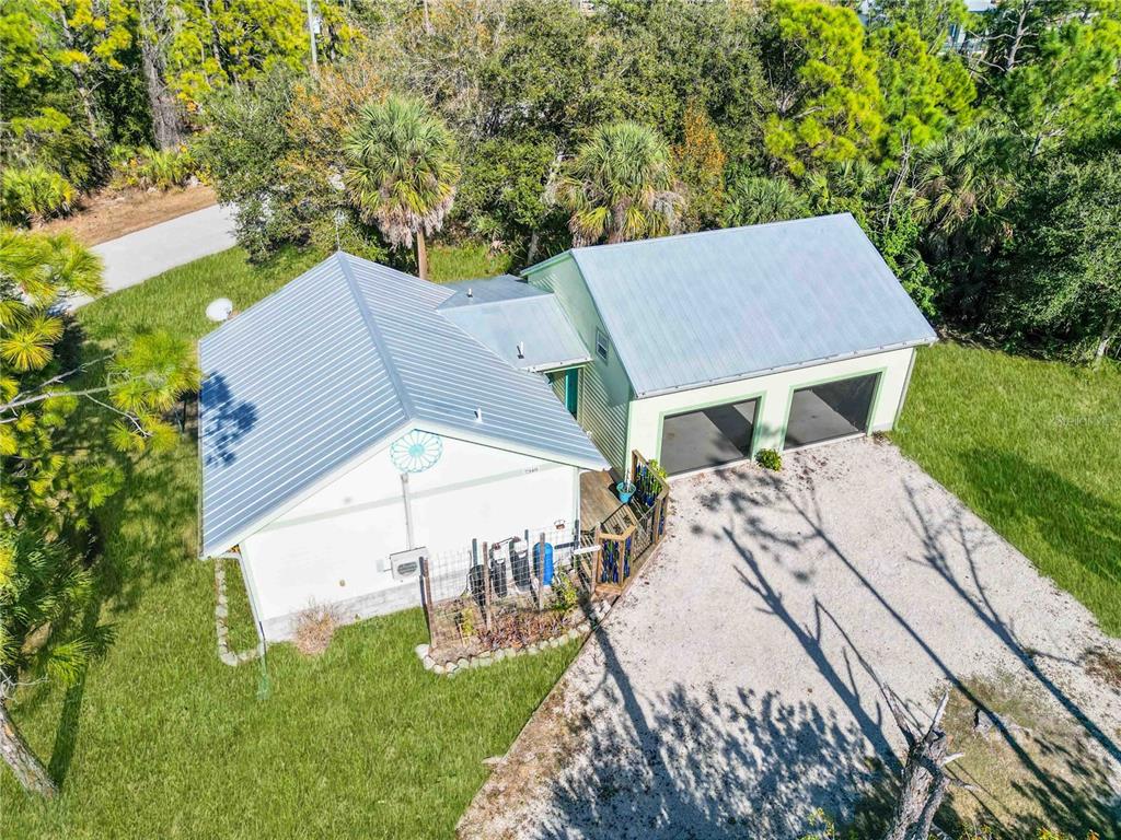 7348 Coach Road Port Charlotte, FL 33981 - Photo 39 of 48 a view of a house with a yard
