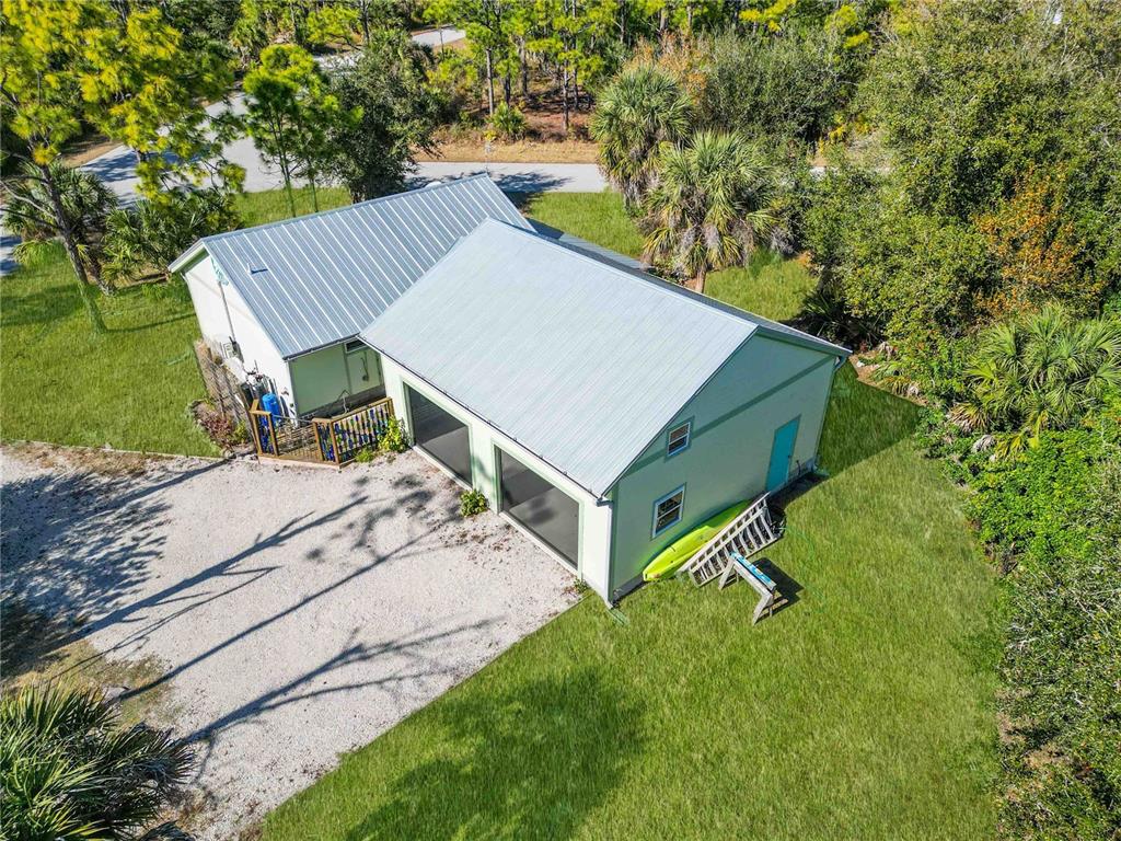 7348 Coach Road Port Charlotte, FL 33981 - Photo 44 of 48 a view of a backyard with a sitting area