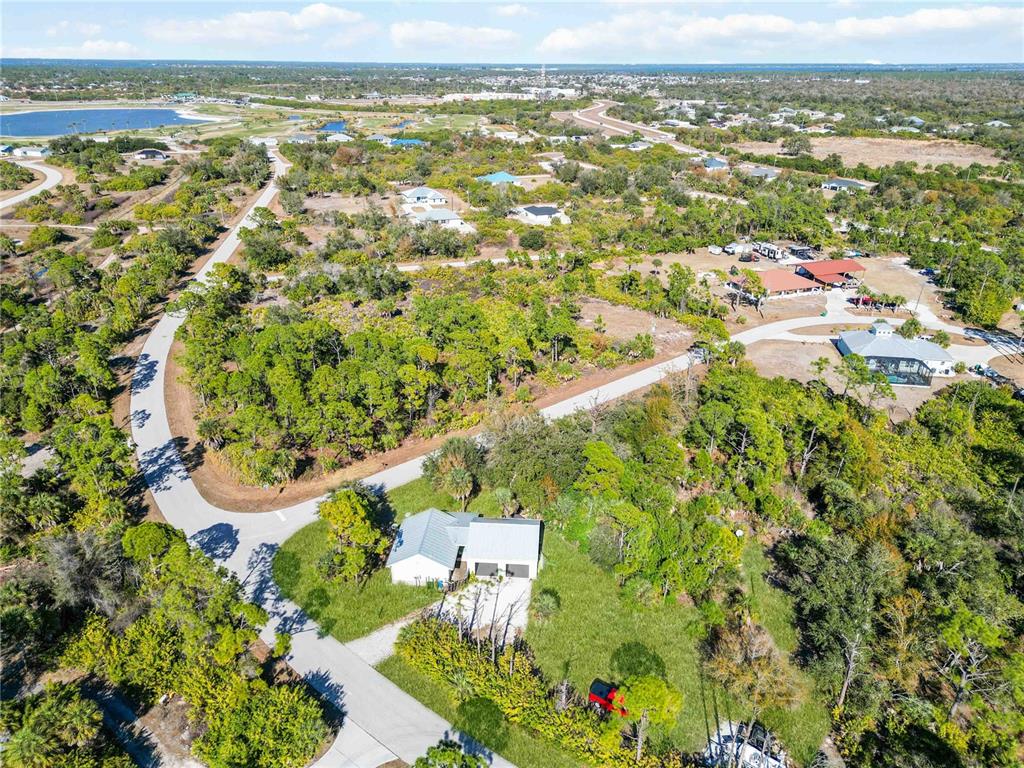 7348 Coach Road Port Charlotte, FL 33981 - Photo 47 of 48 an aerial view of residential houses with outdoor space