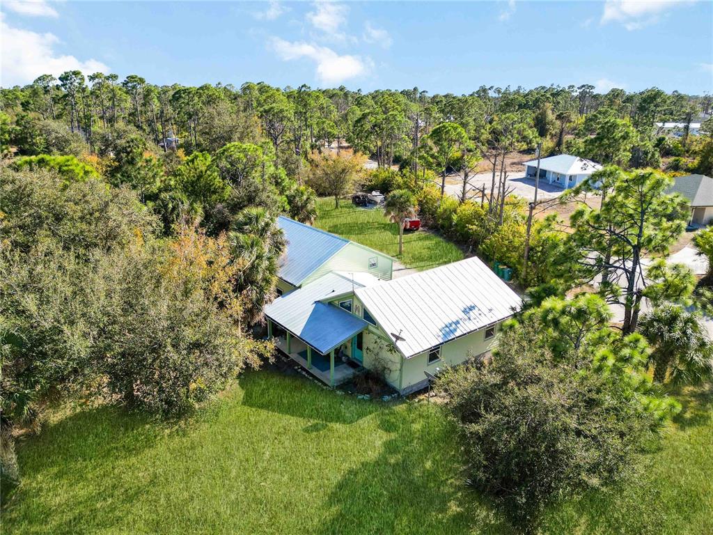 7348 Coach Road Port Charlotte, FL 33981 - Photo 48 of 48 an aerial view of a house with a yard