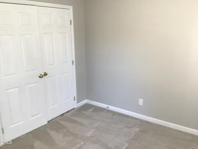 a backyard of a house with yard and outdoor seating