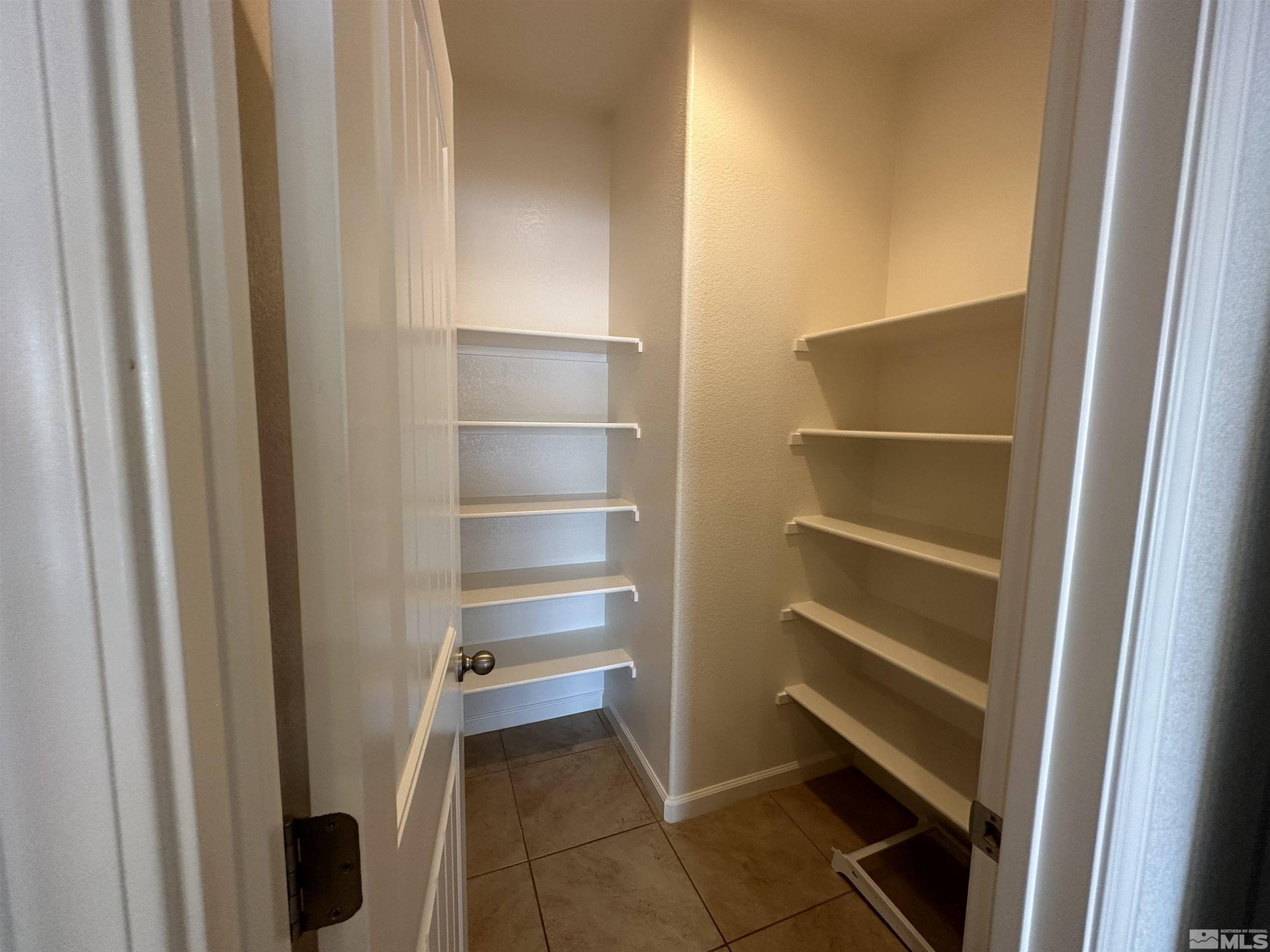1960 Dutch Draft Drive Reno, NV 89521 - Photo 12 of 23 a view of walk in closet with empty racks