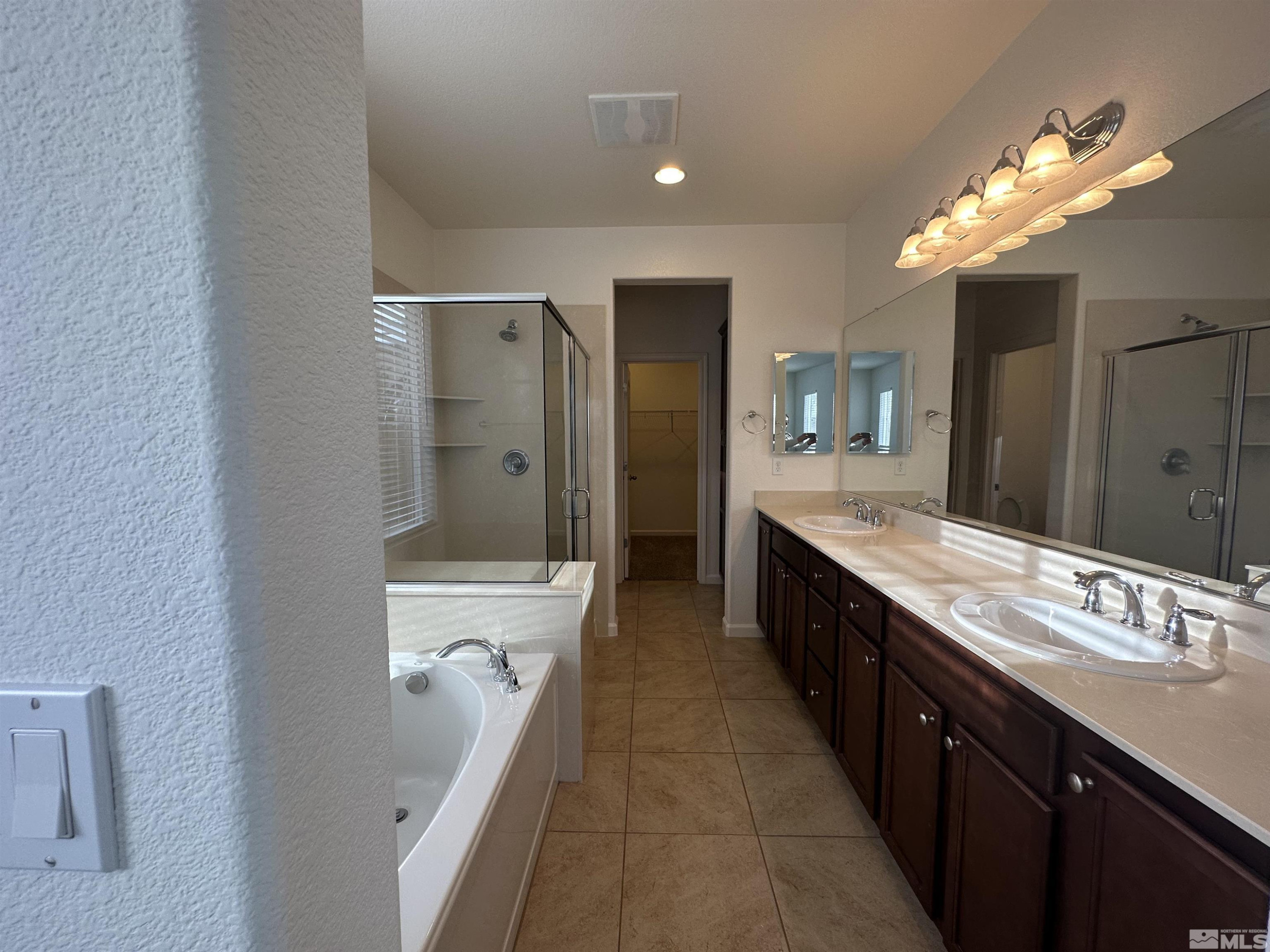 1960 Dutch Draft Drive Reno, NV 89521 - Photo 18 of 23 a bathroom with a double vanity sink a toilet and a shower