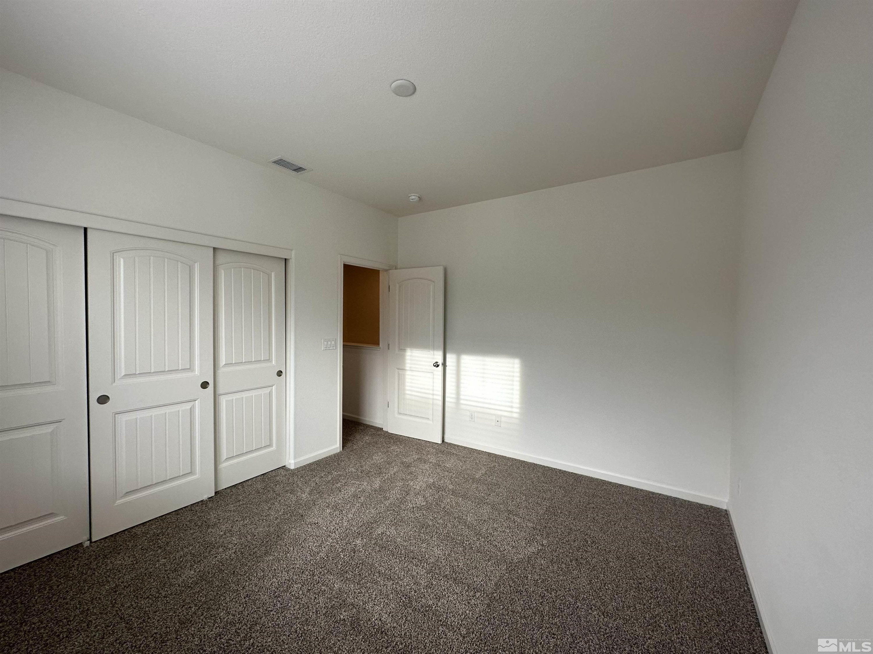 1960 Dutch Draft Drive Reno, NV 89521 - Photo 7 of 23 a view of an empty room and window