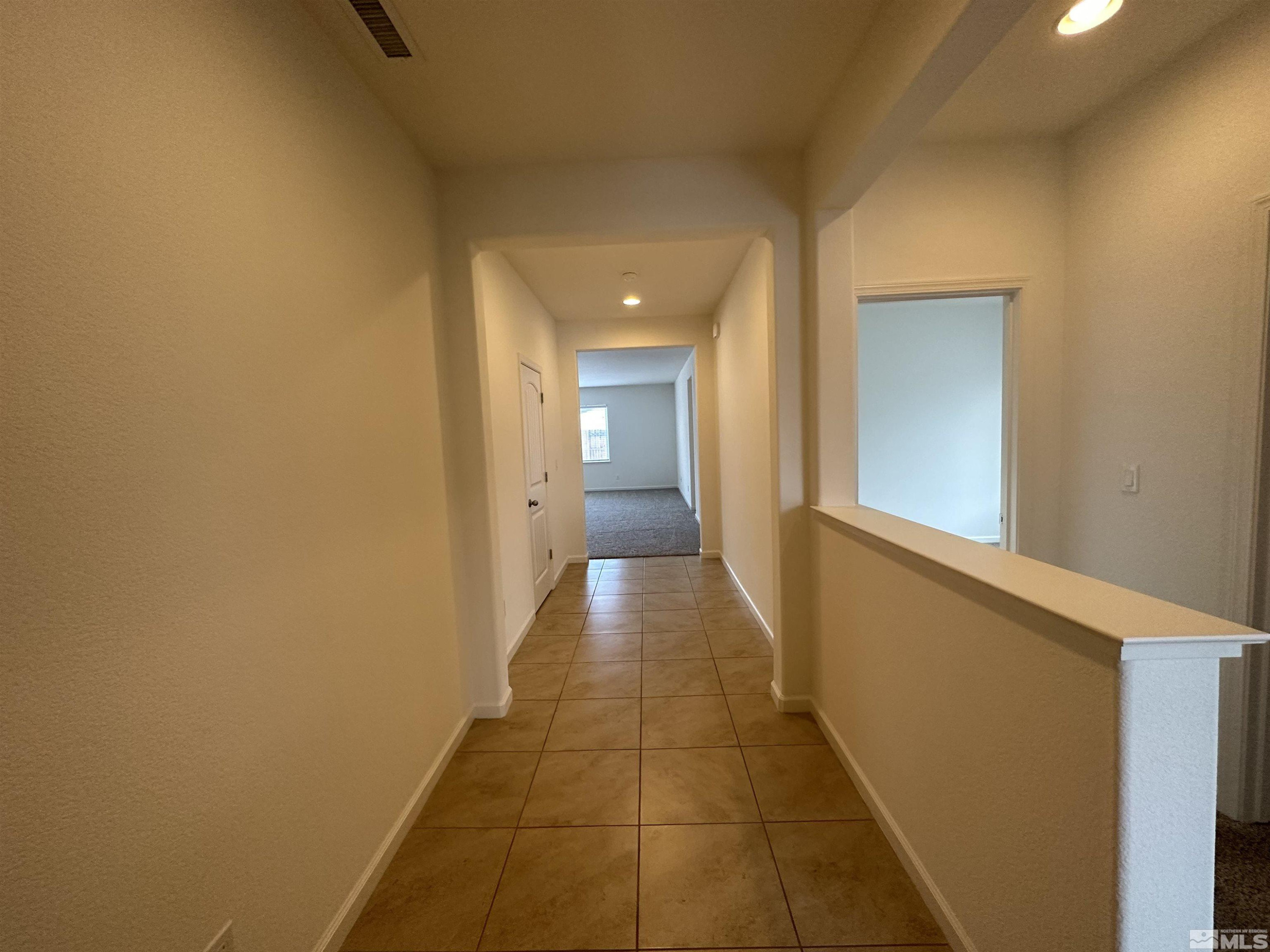 1960 Dutch Draft Drive Reno, NV 89521 - Photo 8 of 23 a view of a hallway with wooden floor