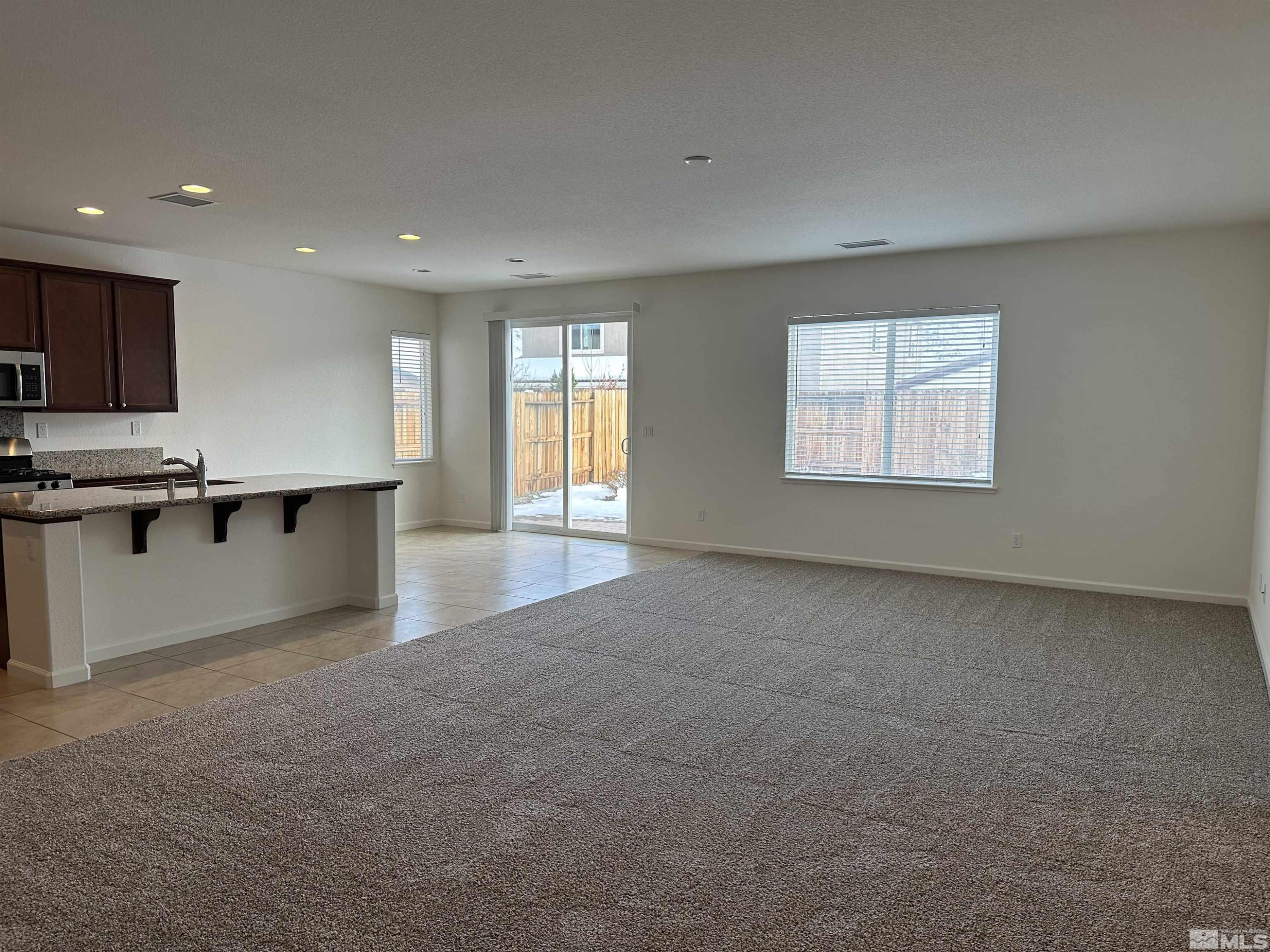 1960 Dutch Draft Drive Reno, NV 89521 - Photo 9 of 23 an empty room with a kitchen view and a window