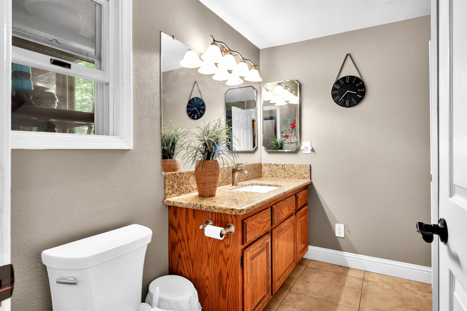 6224 Drop Off Road Pollock Pines, CA 95726 - Photo 12 of 46 a bathroom with a toilet sink and mirror