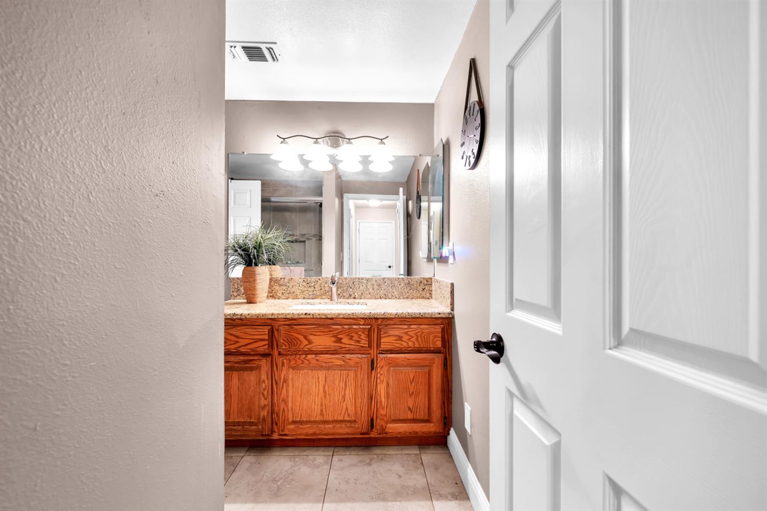 6224 Drop Off Road Pollock Pines, CA 95726 - Photo 13 of 46 a bathroom with a double vanity sink and a mirror