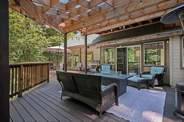 a view of a patio with wooden floor