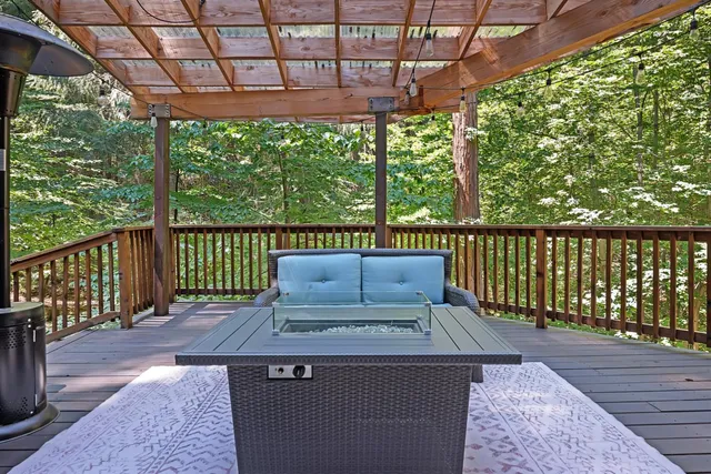 a view of balcony with outdoor seating and wooden floor
