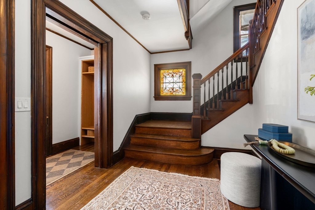 16 Prescott Street Newton, MA 02460 - Photo 11 of 29 a view of entryway and hall with wooden floor