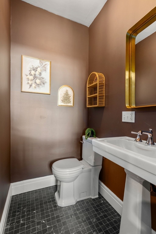 16 Prescott Street Newton, MA 02460 - Photo 12 of 29 a bathroom with a sink a toilet and mirror