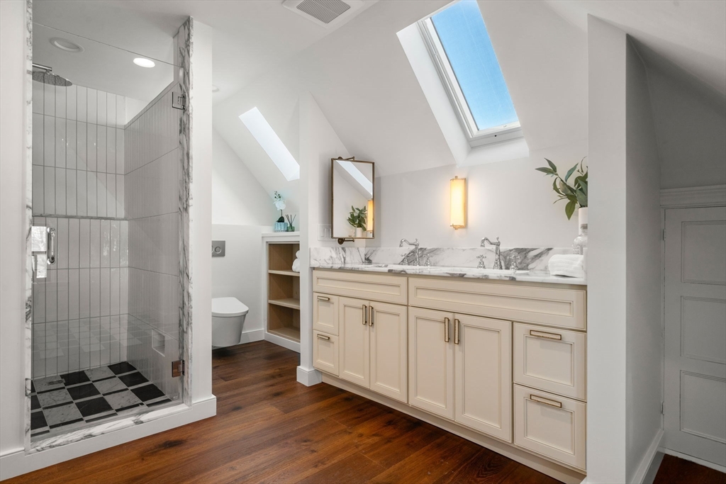 16 Prescott Street Newton, MA 02460 - Photo 19 of 29 a spacious bathroom with a double vanity sink a mirror and a shower