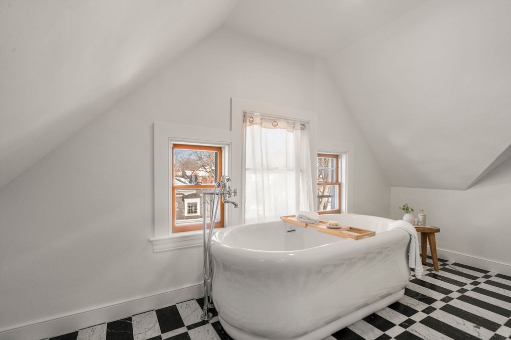 16 Prescott Street Newton, MA 02460 - Photo 20 of 29 a living room with a couch and a table