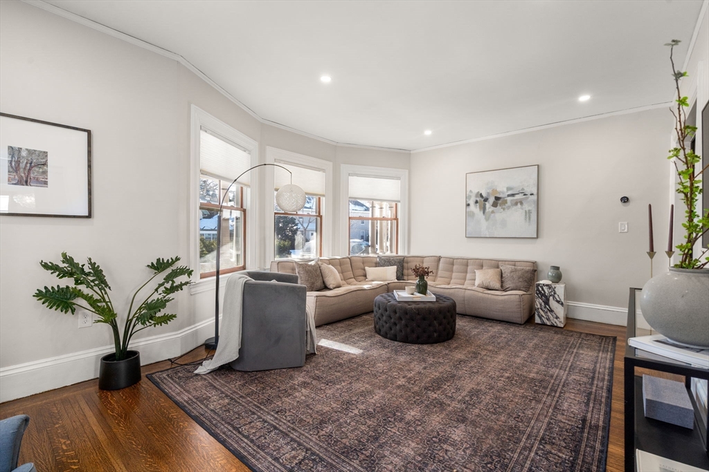 16 Prescott Street Newton, MA 02460 - Photo 10 of 29 a living room with furniture and a potted plant