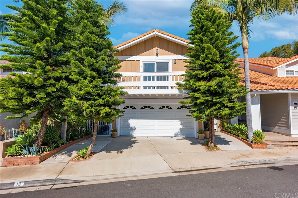 15 Calandria Irvine, CA 92620 - Photo 1 of 49 a front view of a house with a yard and garage