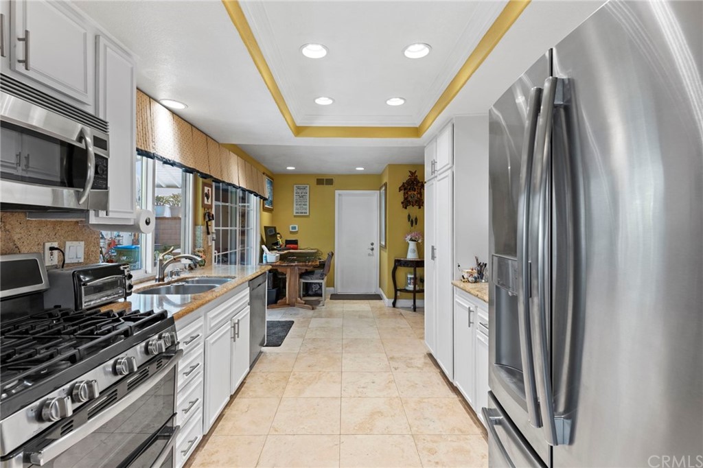 15 Calandria Irvine, CA 92620 - Photo 15 of 49 a kitchen with stainless steel appliances a refrigerator and a stove