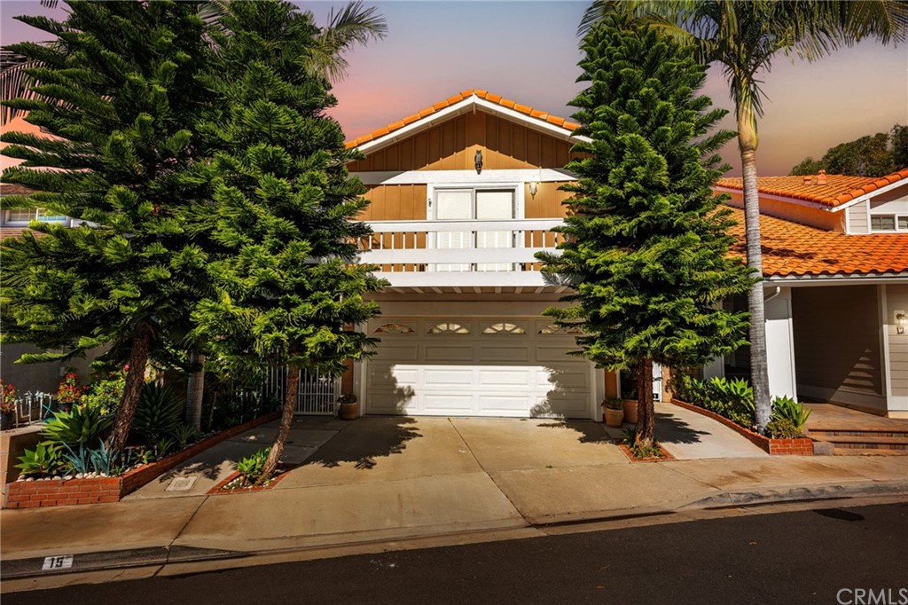 15 Calandria Irvine, CA 92620 - Photo 2 of 49 a front view of a house with a yard and garage