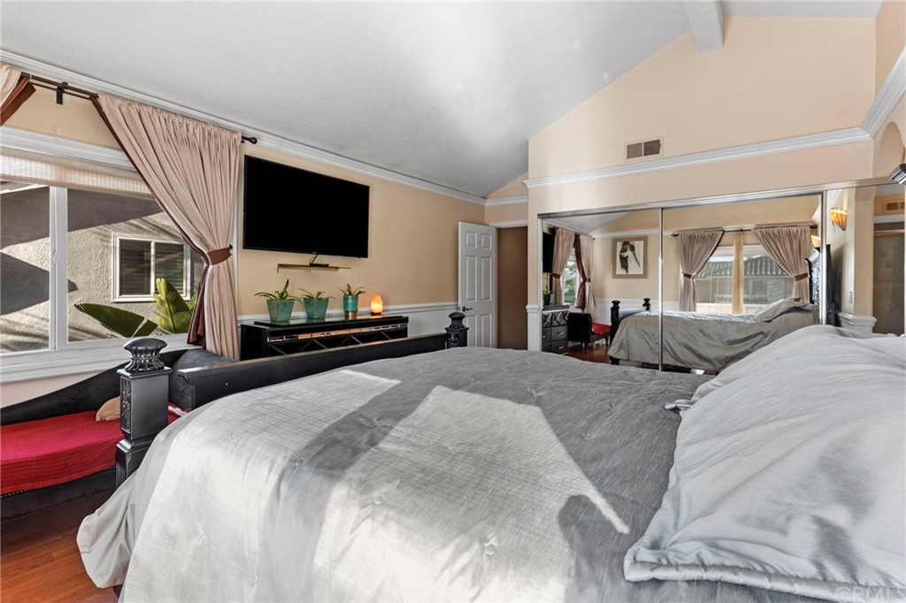 15 Calandria Irvine, CA 92620 - Photo 23 of 49 a bedroom with a bed and a flat screen tv