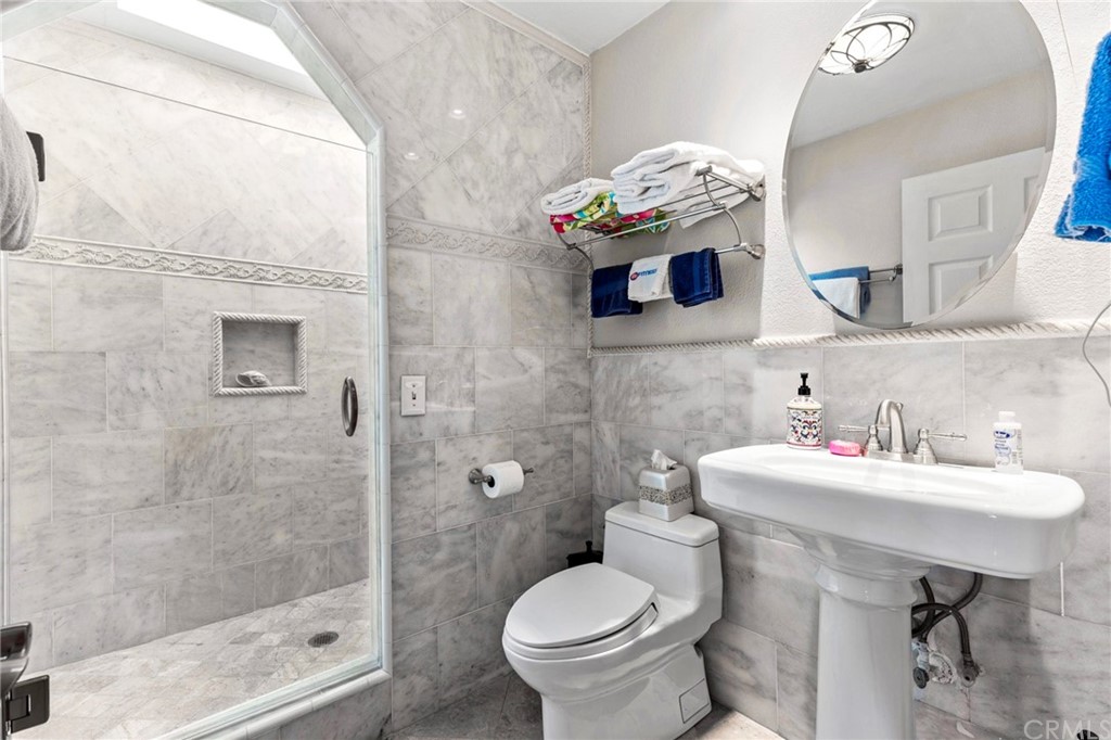 15 Calandria Irvine, CA 92620 - Photo 24 of 49 a bathroom with a sink toilet and a mirror