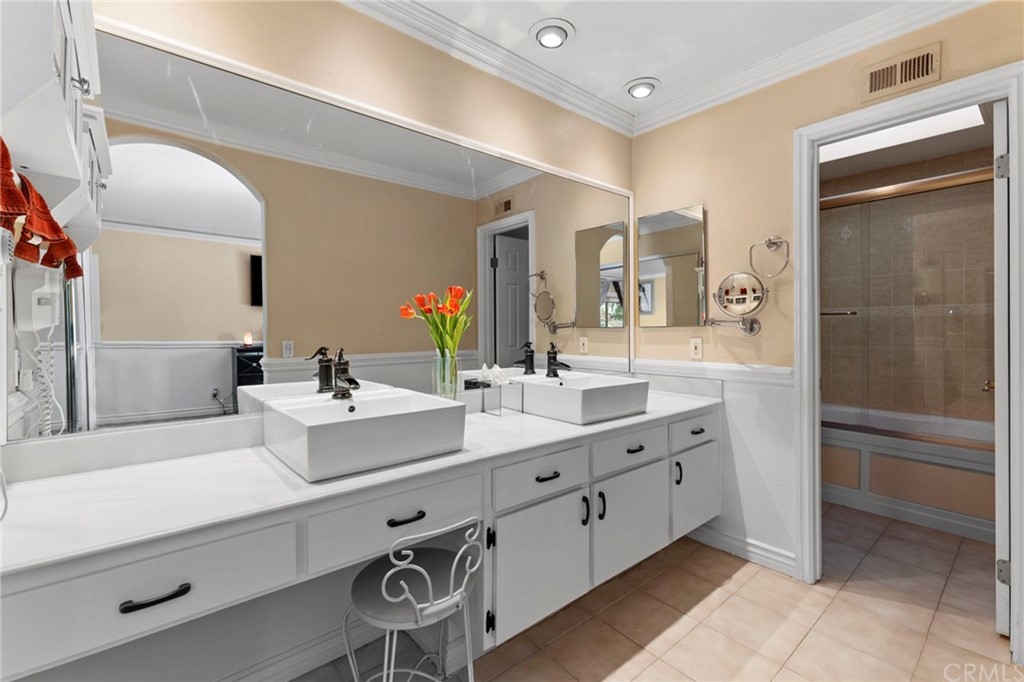 15 Calandria Irvine, CA 92620 - Photo 27 of 49 a bathroom with a sink double vanity and a mirror