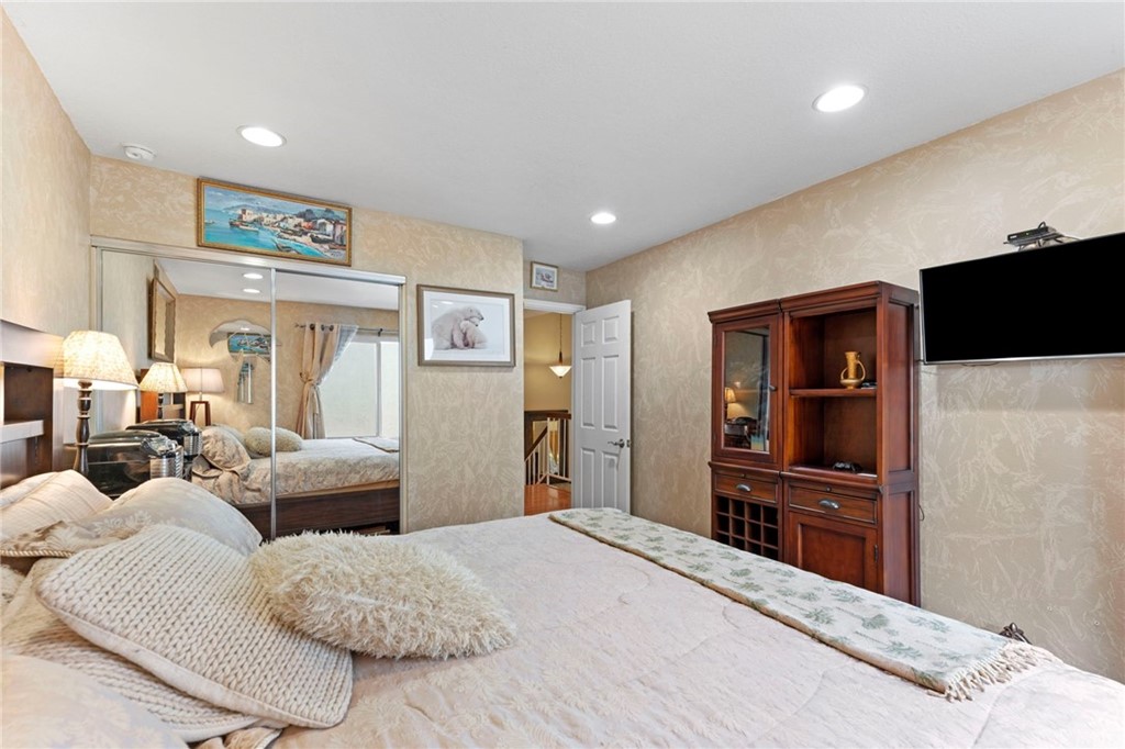 15 Calandria Irvine, CA 92620 - Photo 30 of 49 a bedroom with furniture and a flat screen tv