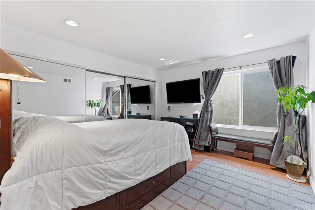 15 Calandria Irvine, CA 92620 - Photo 31 of 49 a bedroom with a bed and flat screen tv