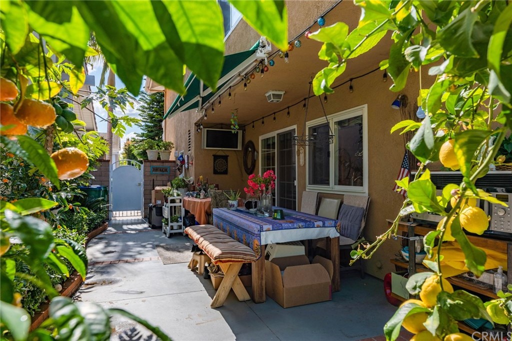 15 Calandria Irvine, CA 92620 - Photo 33 of 49 a view of a patio with table and chairs potted plants and large tree