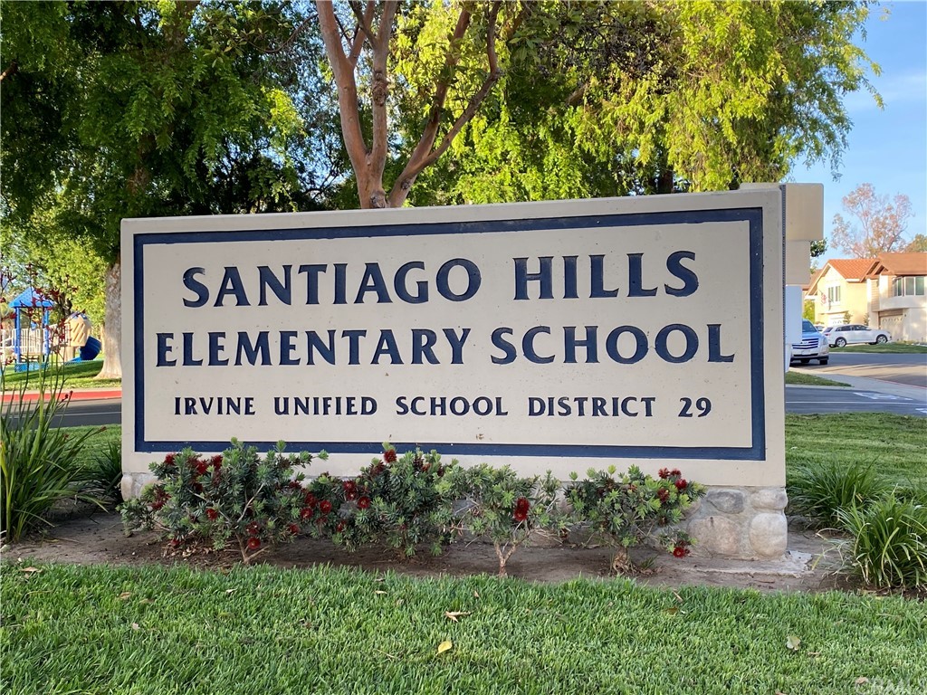 15 Calandria Irvine, CA 92620 - Photo 46 of 49 a sign broad in front of a white house