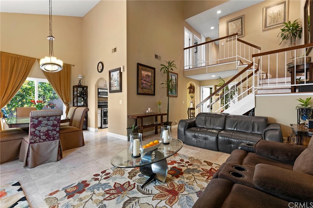 15 Calandria Irvine, CA 92620 - Photo 7 of 49 a living room with furniture wooden floor and a chandelier