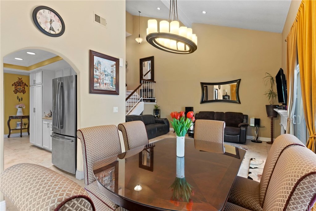 15 Calandria Irvine, CA 92620 - Photo 9 of 49 a living room with furniture chandelier and a mirror