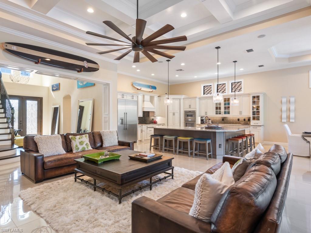 12766 Dundee Lane Naples, FL 34120 - Photo 11 of 37 a living room with furniture and a view of kitchen