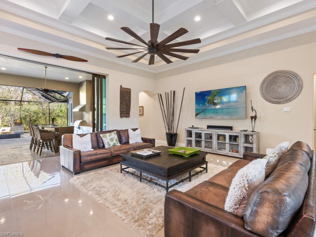 12766 Dundee Lane Naples, FL 34120 - Photo 13 of 37 a living room with furniture and a large window