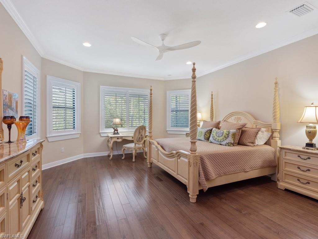 12766 Dundee Lane Naples, FL 34120 - Photo 14 of 37 a bedroom with a bed and a window