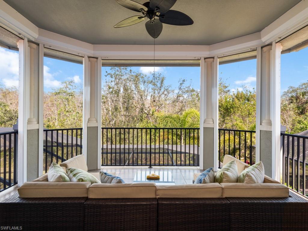 12766 Dundee Lane Naples, FL 34120 - Photo 26 of 37 a bed sitting in a balcony next to a window