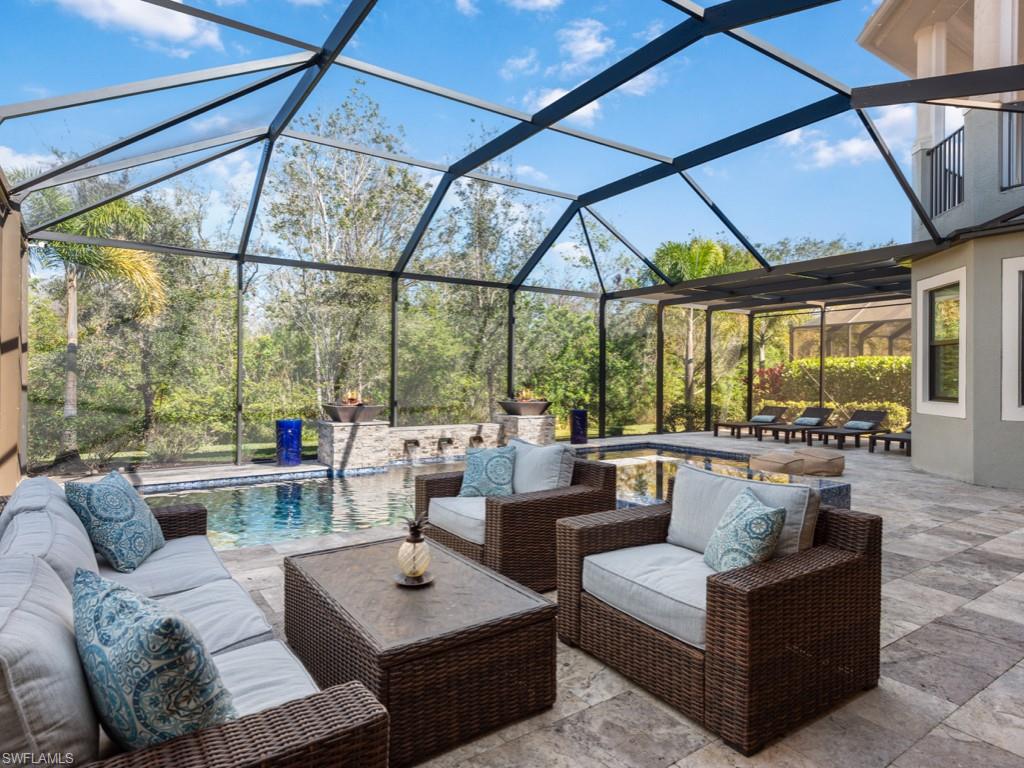 12766 Dundee Lane Naples, FL 34120 - Photo 29 of 37 a living room with furniture and a large window