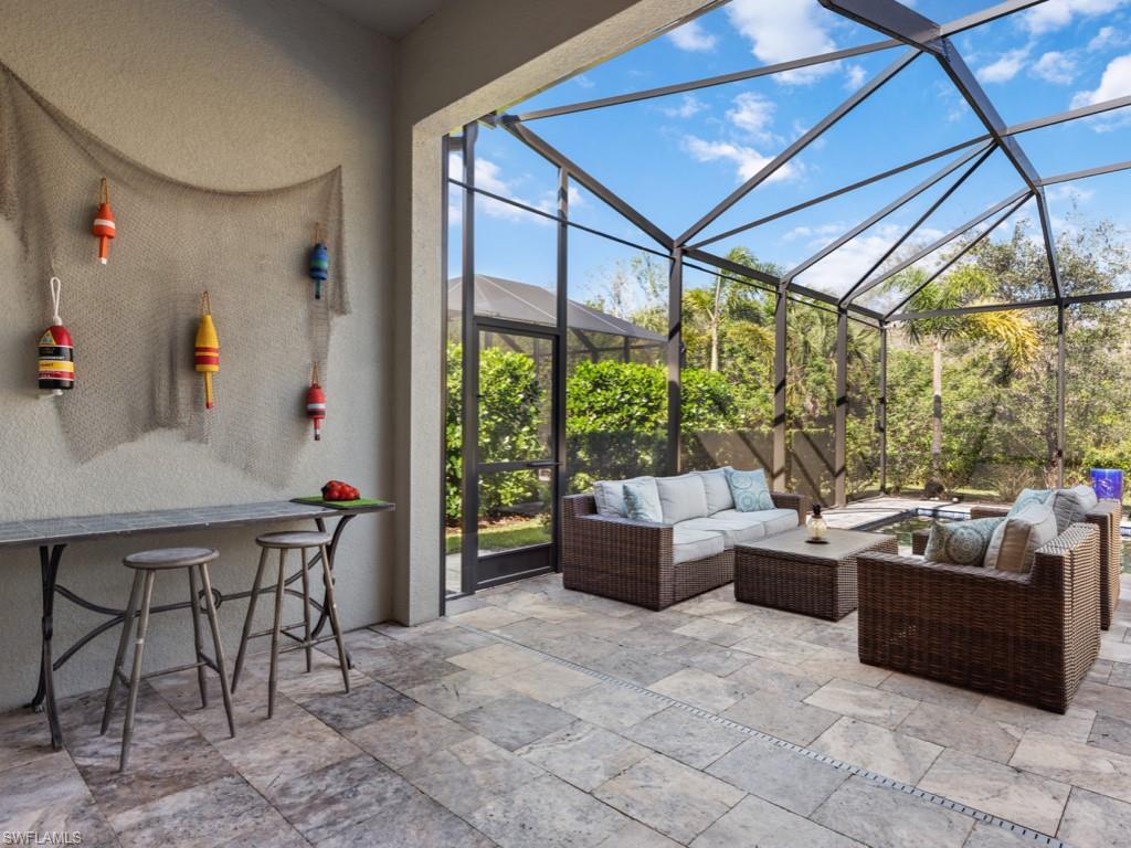 12766 Dundee Lane Naples, FL 34120 - Photo 30 of 37 a outdoor space with patio the couches and dining table with garden view