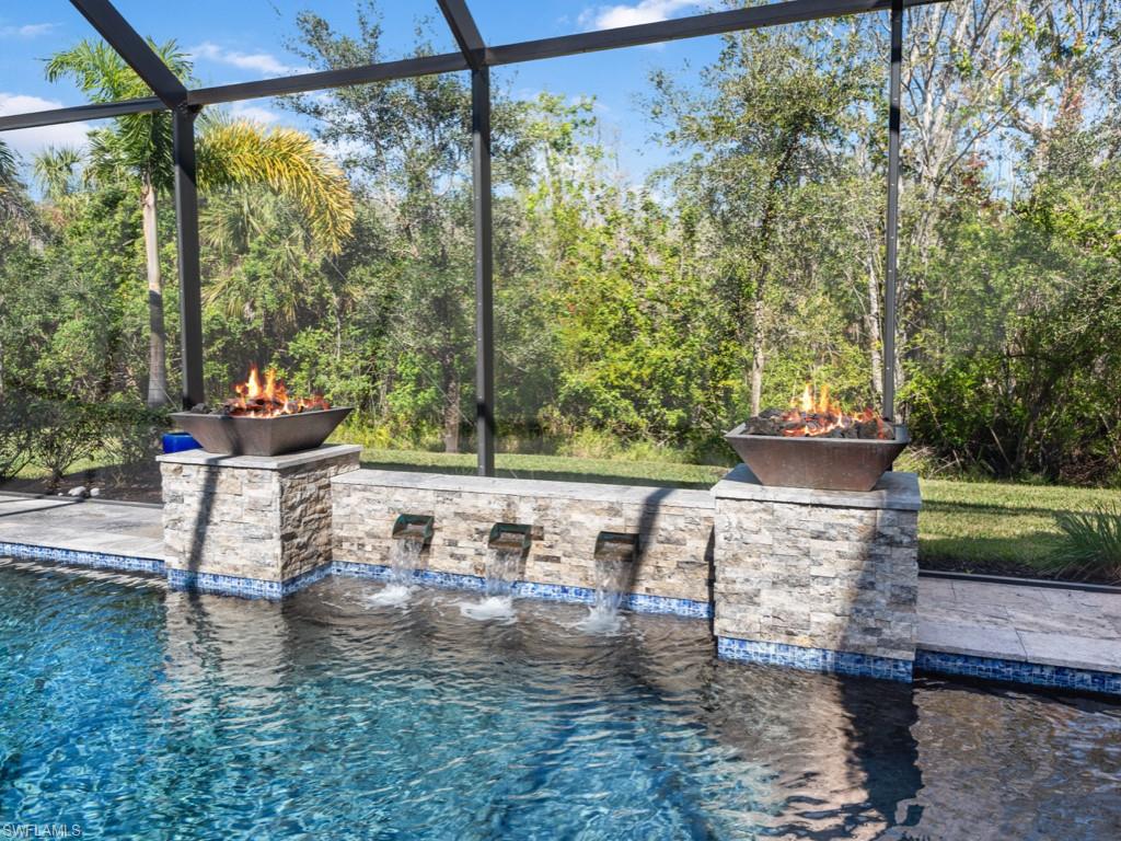 12766 Dundee Lane Naples, FL 34120 - Photo 34 of 37 a view of swimming pool with a patio