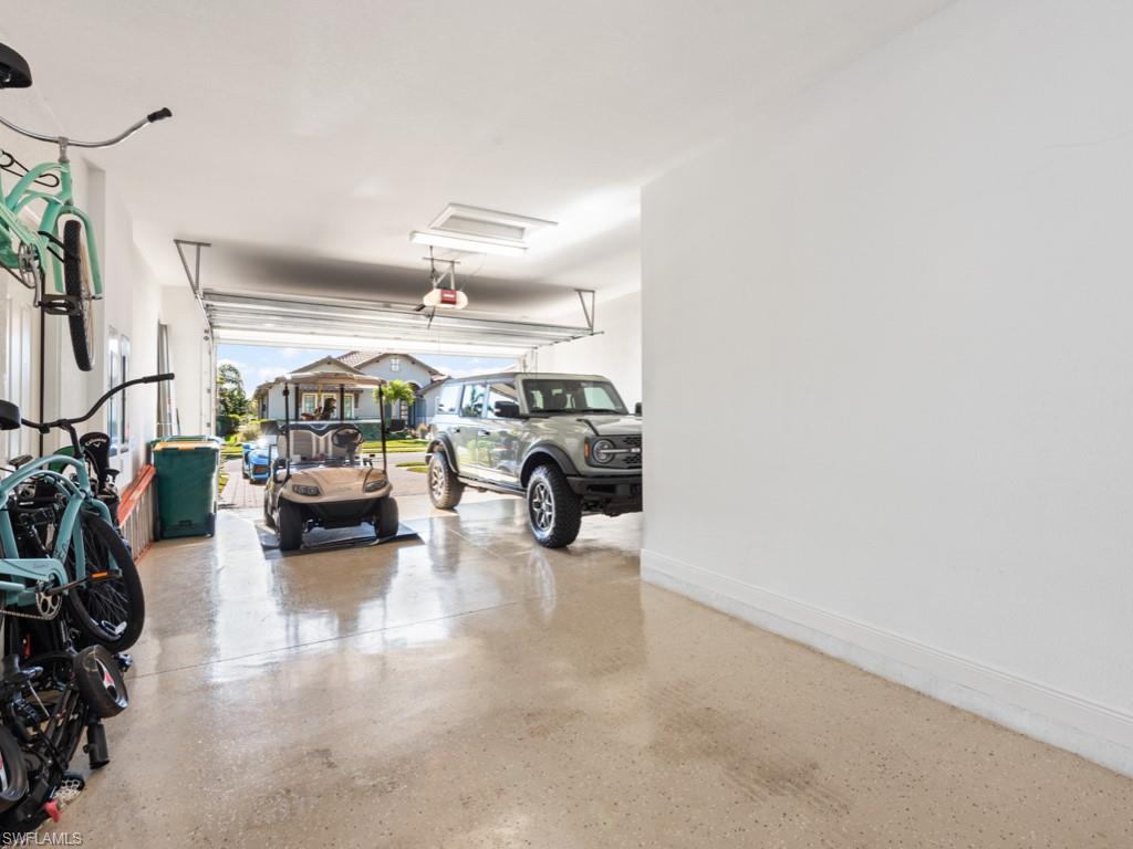 12766 Dundee Lane Naples, FL 34120 - Photo 36 of 37 a view of living area with furniture and a chandelier