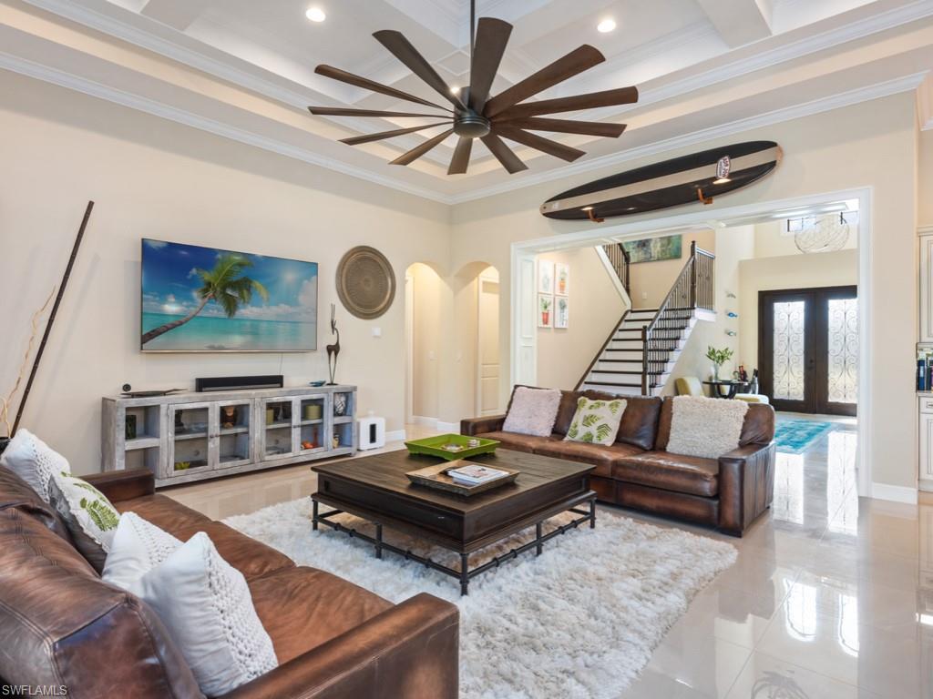 12766 Dundee Lane Naples, FL 34120 - Photo 10 of 37 a living room with furniture and wooden floor