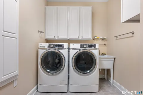 a view of a house with a wooden deck