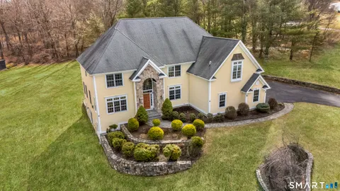 a aerial view of a house with a yard