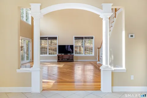 a view of living room with furniture and a fireplace