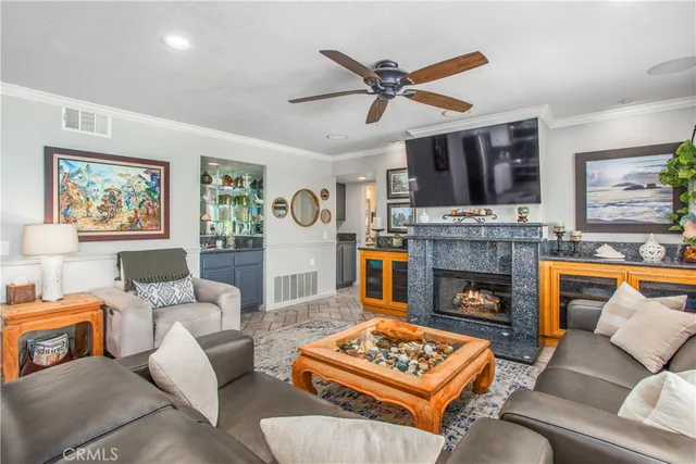 a kitchen with white cabinets a sink dishwasher and a stove with wooden floor