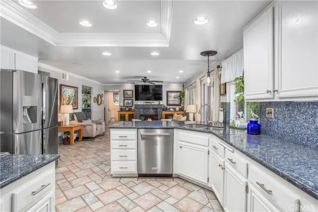 a dining room with furniture and a large window