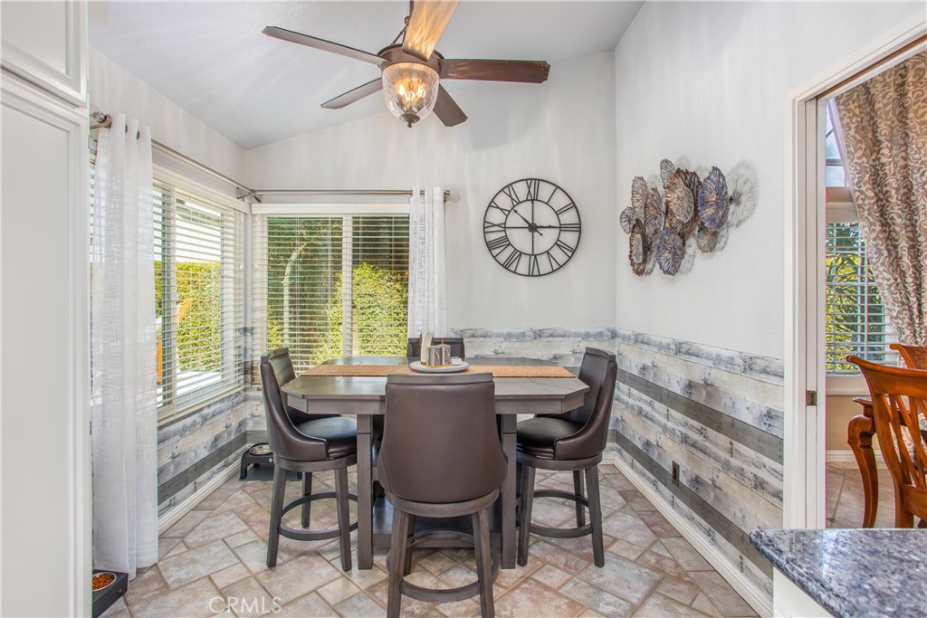 16455 Lake Knoll Parkway Riverside, CA 92503 - Photo 19 of 59 a dining room with furniture and a large window